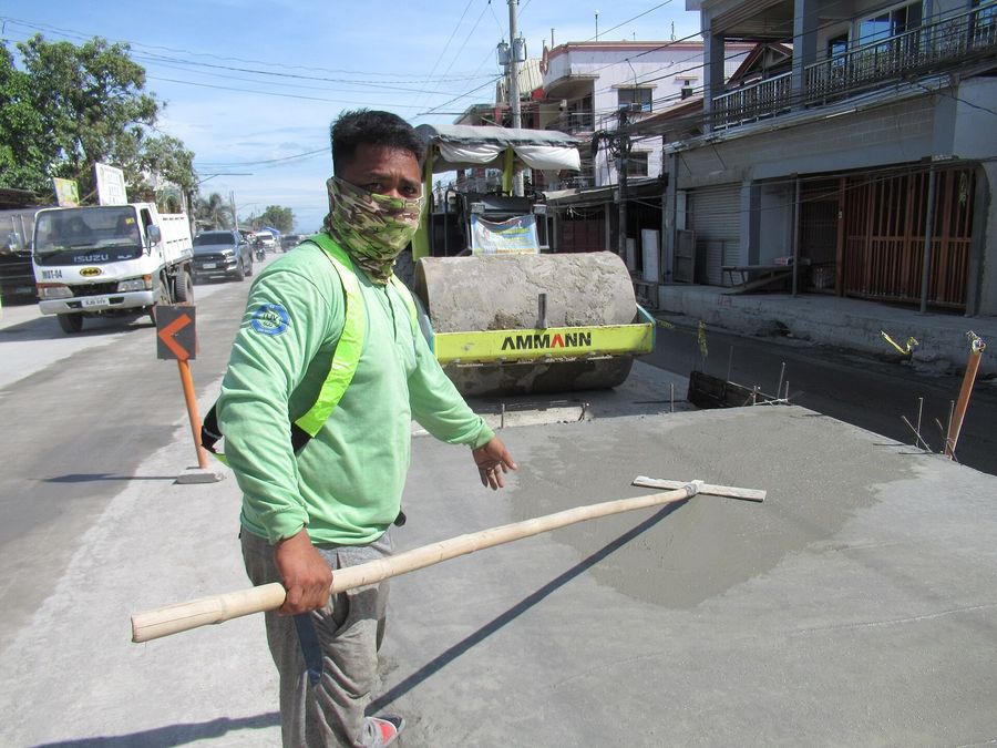 Bull-floating a fresh concrete pour